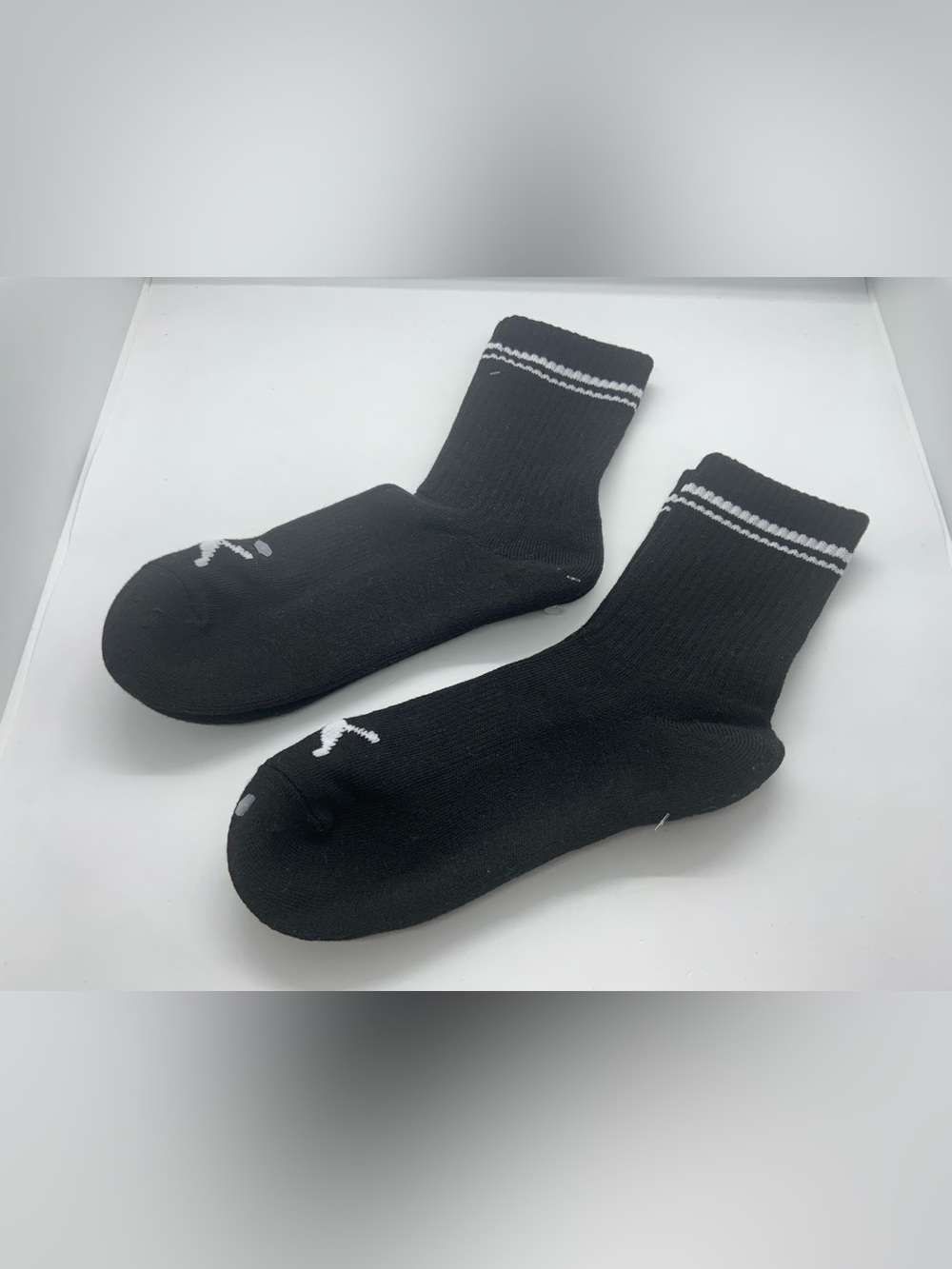 Puma Black Athletic Crew Socks with White Stripes.